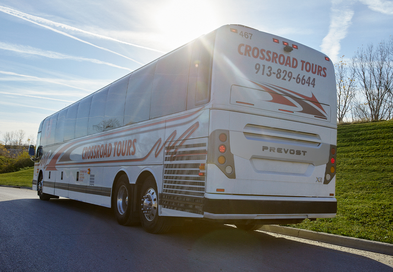 Passenger motorcoach charter bus at sunset